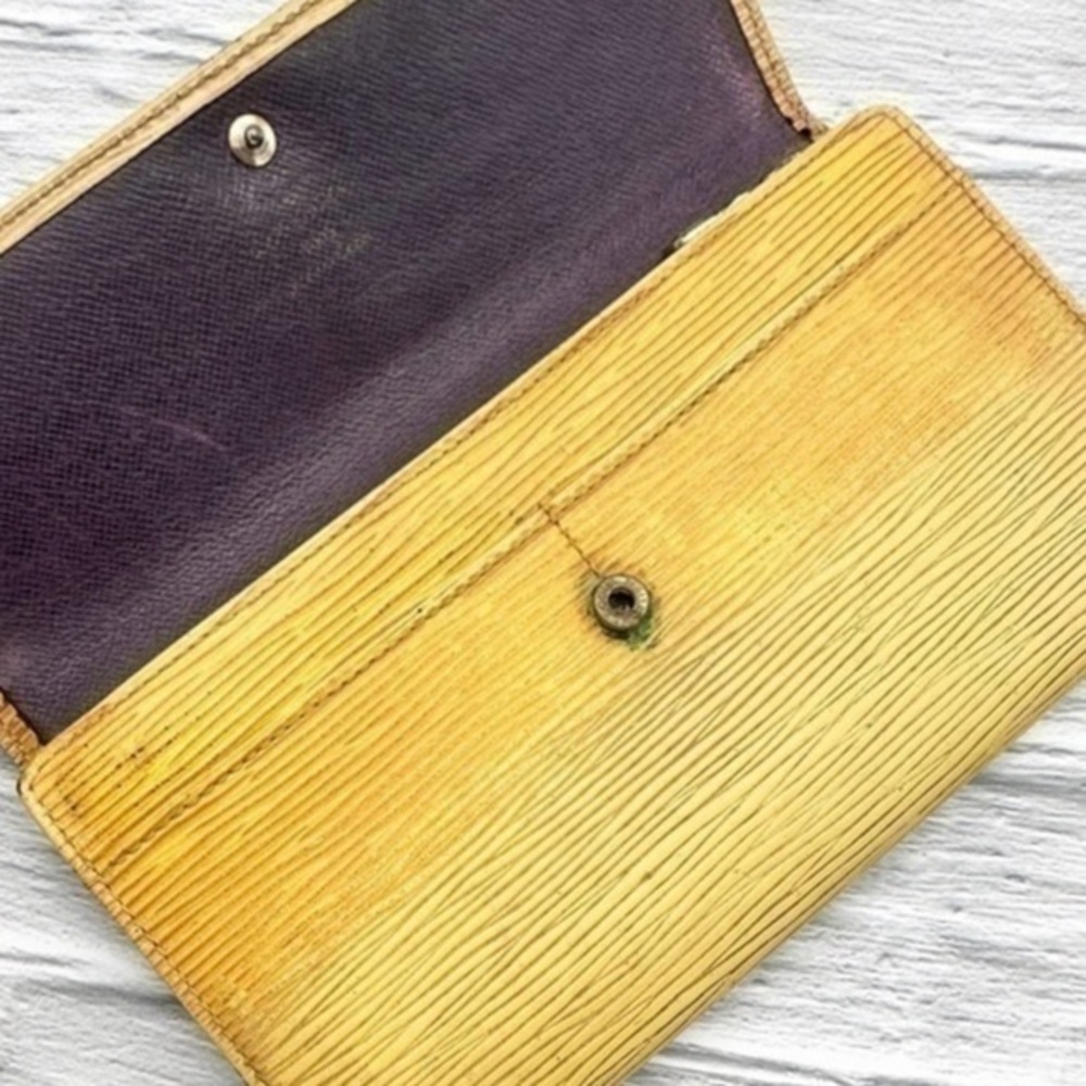 AUTHENTIC Louis Vuitton Epi Porte Tresor International wallet. Tassel yellow.